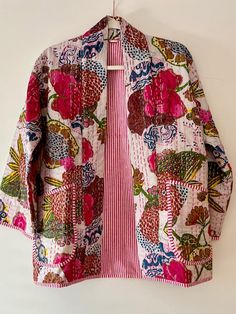 Perfect for adding a burst of color and flair to your wardrobe. This japanese style open jacket is made with embroidery patchwork kantha quilt fabric which is fresh and new. The hand stitching is the specialty of the piece you will see. The jacket is not reversible, but we love to showcase the pinstripes inside by adding a roll or two on the sleeves. You really get a feel for the playful mix of hues and patterns which bring a lively, artistic touch to any outfit, while the lightweight fabric ens Spring Outerwear With Patchwork And Kimono Sleeves, Patchwork Cotton Kimono For Fall, Long Sleeve Cotton Kimono With Patchwork, Cotton Patchwork Long Sleeve Kimono, Long Sleeve Cotton Patchwork Kimono, Fall Cotton Patchwork Kimono, Embroidered Cotton Outerwear With Kimono Sleeves, Multicolor Cotton Outerwear With Kimono Sleeves, Pink Bohemian Cotton Cardigan