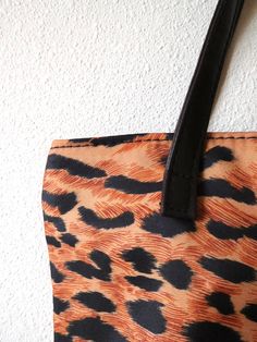 Vintage 1990s Leopard Print Tote. Lovely little animal print tote! DETAILS - Color: black, brown - Material: 100% polyester - Brand: Estee Lauder - vegan MEASUREMENTS (inches) - Dimensions: 9 x 8 x 2 / 22.86 x 20.32 x 5.08 - Handle drop: 5 / 12.7 - - - - - - - - - - - - - - - - - - - - - - - - - - - - - - Please feel free to reach out with any questions you may have! Follow SVV on Instagram: @secondversevintage Brown Shoulder Bag With Animal Design For Shopping, Brown Animal Design Shoulder Bag For Shopping, Everyday Brown Shoulder Bag With Animal Design, Black Shoulder Bag With Animal Design For Shopping, Brown Animal Design Tote Shoulder Bag, Leopard Print Tote, Vegan Animals, Knot Earrings, High Rise Mom Jeans