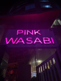 pink wasabi sign lit up in the dark