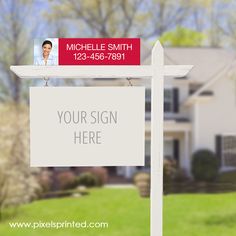 a real estate for sale sign in front of a house with a realtor's photo on it