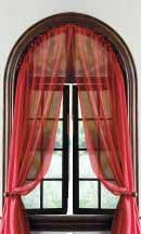 an open window with red curtains on it's sides and a curtain in the middle