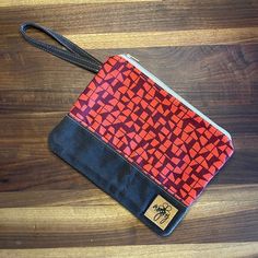 "Geometric Woven with Brown Waxed Canvas, modern small geometric, beautiful designer fabric! Colors are red & maroon.   Fully lined with 100% Cotton Duck Canvas.  Can be used as a wristlet purse, cosmetic bag, storage/organizer pouch inside a larger bag, possibilities are endless.   Small - 8 1/2\"X6\", strap is 5\" Large - 9 1/2\"X7 1/2\", strap is 5\" *measurements are approximate as these are all handmade Spot Clean Only *Pattern by Ithinksew" Electronic Storage, Special Gifts For Her, Pouch Organizer, Wristlet Purse, Duck Canvas, Red Maroon, Waxed Canvas, Designer Fabric, Purse Pouch