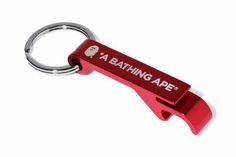 a red keychain with the words bathing ape on it's front side