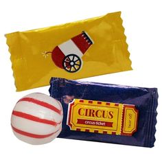 two candy bars, one white and one red with a circus theme on the wrapper