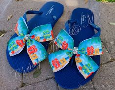 These Sandals are the most cute and fun addition to just about any outfit!    I am using durable, Old Navy brand Flip Flops for each ADULT pair. (WHOLE SIZES ONLY 5-10) These sandals feature a bright blue flip flop and a beautifully printed Beach scene with colorful flip flops sewn together in a ribbon bow with a true rhinestone strung, trimmed center.   Each bow is hand-sewn for the utmost support and also secured to each sandal with a combination of E6000 glue and strong, upholstery thread.  *IN THE PERSONALIZATION SECTION, PLEASE INCLUDE SHOE SIZE **Please remember that these are available in WHOLE SIZES only. If you are typically a half size, please consider SIZING UP as there will be NO RETURNS due to an improper or uncomfortable fit.   OTHER PATTERNS ARE AVAILABLE UPON REQUEST! Ocean Shoes, Summer Flip Flops Beach, E6000 Glue, Shoes Flip Flops, Bow Flip Flops, Flip Flops Beach, Blue Flip Flops, Summer Flip Flops, Beach Flip Flops