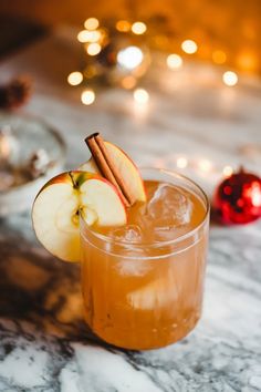 A photo of a  Spiced Apple Gin Fizz a Christmas Gin Cocktails Gin Cider Cocktail, Gin And Apple Cocktail, Fall Gin And Tonic Recipe, Festive Gin Drinks, Apple Gin Cocktail, Christmas Cocktail With Gin, Christmas Ornament Cocktails, Christmas Cocktails Gin, Hendricks Gin Cocktails