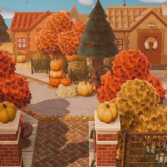 an autumn scene with pumpkins in the foreground and houses on the other side