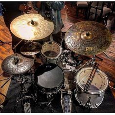 a drum set sitting on top of a wooden floor