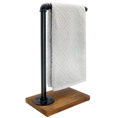 a towel rack with two white towels hanging from it's sides on a wooden shelf