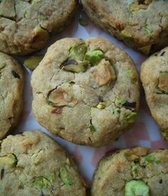 there are many cookies with nuts and pistachios on top of each cookie