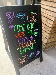 a chalkboard sign with some writing on it