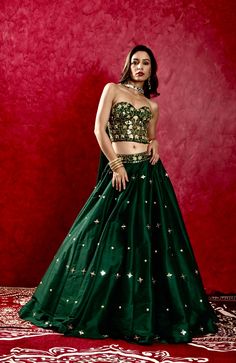 Emerald Green Silk Hand Embroidered Corset paired with Hand Embroidered Silk Lehenga and Geogette Choker Dupatta Embroidered Brocade Floor-length Sets, Embroidered Floor-length Brocade Sets, Festive Brocade Sets With Intricate Embroidery, Traditional Sequined Wedding Sets, Traditional Raw Silk Lehenga With Sequins, Traditional Sequined Raw Silk Lehenga, Embellished Art Silk Designer Wear Set, Sequin Raw Silk Set For Reception, Embroidered Brocade Sets For Reception