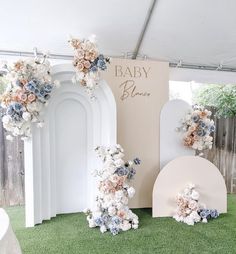 baby shower decorations with flowers on the grass