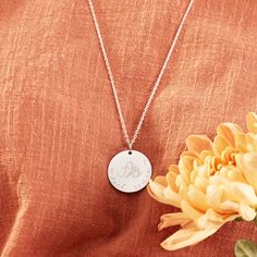 Our Personalized Large Floral Alphabet Necklace symbolizes the nature of our interweaved lives and deepest connections. Choose from our range of delicate floral letters, numbers or symbols, paired with your hand-engraved message to create a one-of-a-kind keepsake.18K Champagne Gold Plated, 925 Sterling Silver or 18K Rose Gold PlatedCharm size: 1 x 1Secure clasp fasteningCharms are removable from this chain and can be worn on all Merci Maman chain lengthsHand engraved in our Paris workshopSent wi Symbolic Stamped Necklace For Anniversary, Symbolic Silver Necklace With Laser Engraving, Spiritual Sterling Silver Jewelry With Engraved Text, Silver Engraved Text Pendant Necklace, Silver Pendant Necklace With Engraved Text, Spiritual Engraved Name Necklace As Gift, Spiritual Engraved Name Necklace For Gift, Mother's Day Engraved Initial Pendant Necklace, Engraved Initial Pendant Necklace For Mother's Day