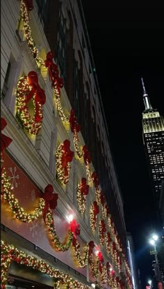 christmas lights adorn the side of a building in new york city