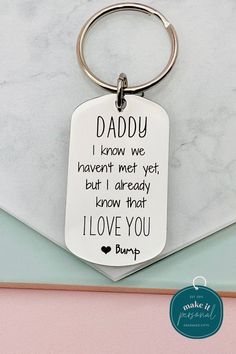 a keychain that says daddy i know we haven't met yet but already know