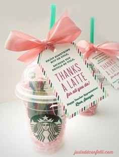 two starbucks coffee cups with pink bows and thank you notes on the top, one is for teacher appreciation gift idea