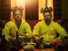 two men in yellow raincoats sitting next to each other