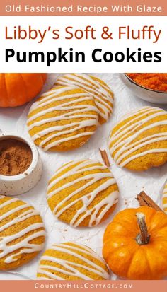 pumpkin cookies with white glaze on top and in the background are small pumpkins