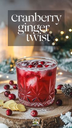 a cranberry ginger twist in a glass with lemon wedges