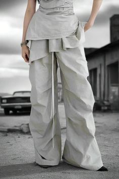 Dune Drift Ruffled Wide-Leg Pants LAZERorange Post Apocalyptic Fashion, Apocalyptic Fashion, Drawstring Trousers, Ruffle Design, White Tone, Pleated Trousers, Streetwear Casual, Avant Garde Fashion, Post Apocalyptic