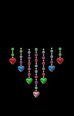 colorful hearts are arranged in the shape of beads on a black background with space for text