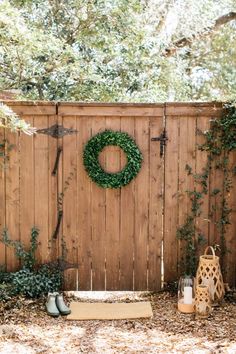 a wooden fence with a wreath on it