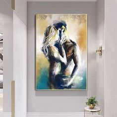 a painting hanging on the wall in a living room