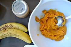 a white bowl filled with mashed potatoes next to two bananas and a jar of peanut butter