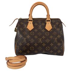 100% authentic Louis Vuitton Speedy 25 bag in signature brown and camel monogram canvas featuring Vachetta leather shoulder-strap, handles and trimming. Originally created for travelers in the 1930s – the name refers to the era’s rapid transit – every feature of the Speedy’s design is iconic, from its unmistakable shape to the rolled leather handles, engraved padlock and detachable strap. Has been carried and shows some faint patina and darkening to the handles. Overall in excellent condition. Measurements Height 22cm (8.6in) Width 25cm (9.8in) Depth 14cm (5.5in) Drop of the Handle 8cm (3.1in) Shoulder Strap Length 125cm (48.8in) Hardware Gold-Tone Blindstamp DU 1059 All our listings include only the listed item unless otherwise specified in the description above Louis Vuitton Store, Louis Vuitton Speedy 25, Rapid Transit, Speedy 25, Louis Vuitton Brown, Speedy 30, Heart Bag, Lv Monogram, Bottega Veneta Shoulder Bag