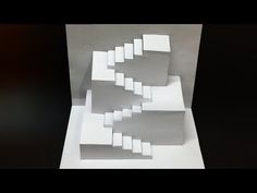 an image of a white sculpture made out of squares and rectangles on a black background