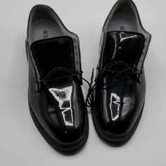 Bates High Gloss Oxfords Dress Shoes, Vibram Sole, Uniform Footwear, Size 10 E, In Excellent Pre-Owned Condition, Soles Appear Unused (See Pictures), Laces Are Included, They Just Aren't Threaded Through The Eyelets. Wt: Almost 3 Lbs Formal Synthetic Oxfords With Pointed Toe, Fitted Synthetic Dress Shoes For Party, Formal Flat Synthetic Oxfords, Formal Lace-up Synthetic Oxfords, Black Plain Toe Oxfords For Party, Black Lace-up Oxfords For Party, Formal Closed Toe Synthetic Dress Shoes, Classic Black Dress Shoes For Parties, Black Patent Leather Flat Oxfords