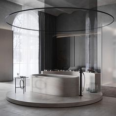 a large white bath tub sitting in the middle of a room next to a window