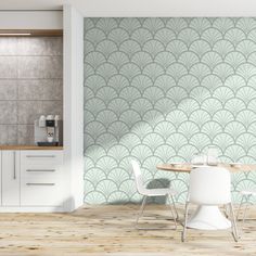 a dining room table and chairs in front of a wall with an art deco pattern