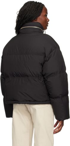 Down-filled and quilted nylon taffeta jacket. Water-repellent. · Stowaway hood at funnel neck · Two-way zip closure · Leather logo patch at chest · Welt pockets · Bungee-style drawstring at hem · Dropped shoulders · Inset rib-knit cuffs · Welt pockets at interior · Full taffeta lining Supplier color: Black Fill: 90% down, 10% feather. Hooded Quilted Nylon Jacket With Padded Collar, Hooded Nylon Quilted Jacket For Streetwear, Streetwear Quilted Down Puffer Jacket, Quilted Down Puffer Jacket For Streetwear, Quilted Nylon Hooded Jacket For Streetwear, Streetwear Down Puffer Jacket With Padded Collar, Down Puffer Jacket With Padded Collar For Streetwear, Quilted Duck Down Streetwear Outerwear, Quilted Duck Down Outerwear For Streetwear