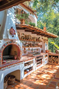 an outdoor oven with many pots and pans on it