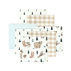 three napkins with animals and trees on them