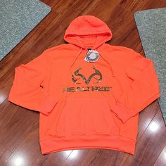 Nwt Men's Size L Realtree Hoodie. Neony Orange With Camo Logo. Orange Long Sleeve Sports Hoodie, Orange Hooded Sports Sweatshirt, Orange Hooded Sweatshirt For Sports, Orange Fall Sports Sweatshirt, Orange Sweatshirt For Sports In Fall, Orange Sweatshirt For Fall Sports, Orange Sports Hoodie For Winter, Orange Hoodie For Sports In Winter, Orange Hoodie For Winter Sports