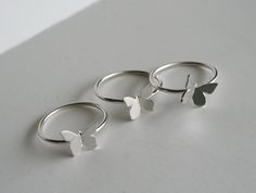 "Beautiful Set of Stacking Butterfly Rings! Each butterfly is drawn, cut and textured by hand, from solid sterling silver, making each one unique.They're individually soldered to they're own handmade sterling silver ring. The rings can be worn all together or separate. The butterfly's are about 3/8\". Rings can also be made in different sizes if you would like them for different fingers. Comes gift wrapped! Each item is handcrafted per order. Please let us know if you need multiple items boxed s Stacking Rings Silver, Rings Butterfly, Butterfly Rings, Rings Stacking, Bff Jewelry, Jewelry Nature, Handmade Sterling Silver Rings, Jewelry Words, Three Rings