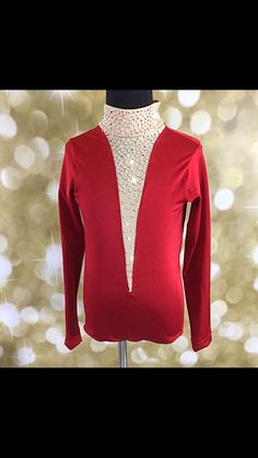 a mannequin wearing a red sweater with sequins on the neckline