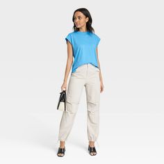 This Short-Sleeve Extended Shoulder T-Shirt from A New Day™ offers the perfect way to add a chic new option to your wardrobe. The solid-color T-shirt is made from a breathable fabric blend for all-day comfort, and it can be dressed up or down to fit any occasion. It's tailored in a casual fit that hits at the hip and features side vents and short sleeves with extended shoulders for an extra-stylish touch. A New Day™: Style that goes wherever you do. Versatile Relaxed Fit T-shirt For Spring, Versatile Cotton T-shirt For Spring, Versatile Cotton T-shirt, Versatile Plain Cotton T-shirt, Versatile Cotton T-shirt For Summer, Versatile Cotton T-shirt For Work, Casual Workwear T-shirt, Casual Fit, Womens Clothing Sizes