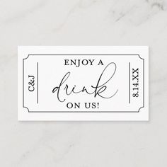 a black and white ticket with the words, enjoy a drink on us