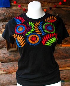 "Mexican embroidered shirt Beautiful embroidered blouse. This is handmade in Mexico. Perfect for those summer days at the beach, or for your fiesta parties. The embroidery colors may vary due all the handmade work (not the design). If you want an specific color, please send us a message so we can send you the ones available so you can choose. Size: Extra Small: 13\" width x 22\" long Small; 14\" width x 23\" long Medium: 15 1/2\" width x 24\" long (Width: shoulder - shoulder) Please also notice Bohemian Shirt With Multicolor Embroidery, Multicolor Floral Embroidery T-shirt For Summer, Summer Festival Embroidered Shirt, Summer Embroidered Multicolor Shirt, Embroidered Folk Shirt For Summer, Summer Folk Style Embroidered Shirt, Traditional Multicolor Embroidered Shirt For Summer, Traditional Shirt With Multicolor Embroidery For Summer, Summer Embroidered Shirt With Multicolor Embroidery