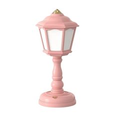 a pink lamp on a white background