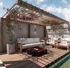 an outdoor living area with couches, tables and flowers on the pergolated roof