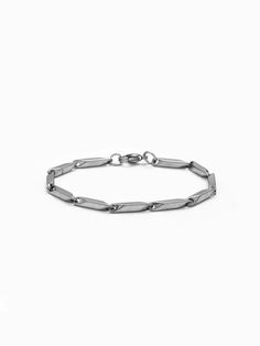 Explore our Men's Chain Bracelet, a blend of subtlety and strength. This dainty yet durable bracelet, crafted from stainless steel, features a unique twisted chain design. Perfect for wearing alone or as part of a layered look, it's a stylish piece that resonates with modern masculinity. Classic Stainless Steel Oval Link Bracelet, Modern Bracelets With Stainless Steel Clasp And Rectangular Links, Minimalist Sterling Silver Bracelet With Solid Link, Minimalist Everyday Bracelet With Stainless Steel Clasp, Everyday Stainless Steel Bracelet With Rectangular Links, Minimalist Adjustable Sterling Silver Bracelet With Solid Link, Modern Stainless Steel Chain Bracelet With Solid Links, Adjustable Silver Chain Bracelet With Rectangular Links, Modern Everyday Chain Bracelet With Stainless Steel Clasp