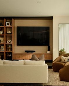 Devon Wegman (@dgi_designbuild) • Instagram photos and videos Modern Media Built In, Hidden Entertainment Center, Salon Shelves, Built In Tv, Living Room Redesign, Beige Sectional, Chicago Interior Design, Retro Revival, Chicago Design