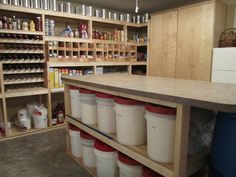 an empty storage room with many containers on the shelves