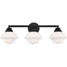 three light bathroom fixture with black finish and white glass shades on the top, in an old - world style design