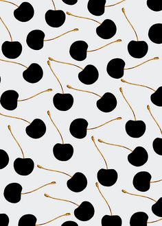 black and gold cherries on a white background with golden stems in the shape of hearts